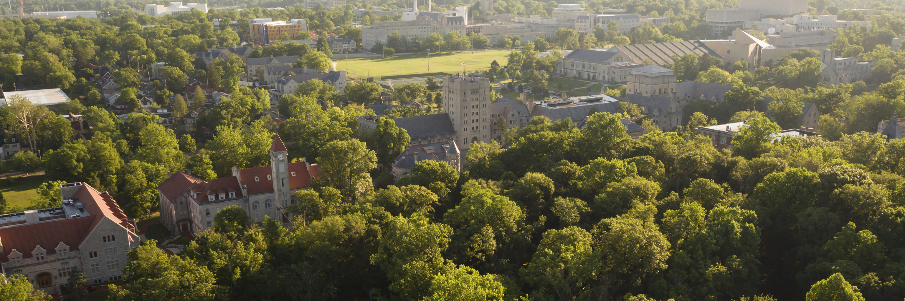 Aerial view of the forested Indiana University Bloomington campus.