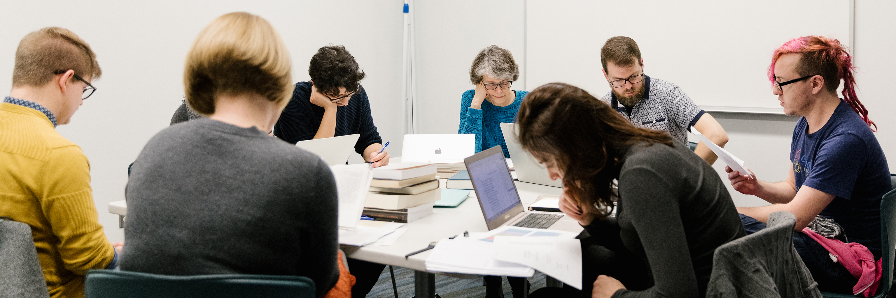 Image of students participating in the Old Occitan Reading Group on the Indiana University Bloomington campus.