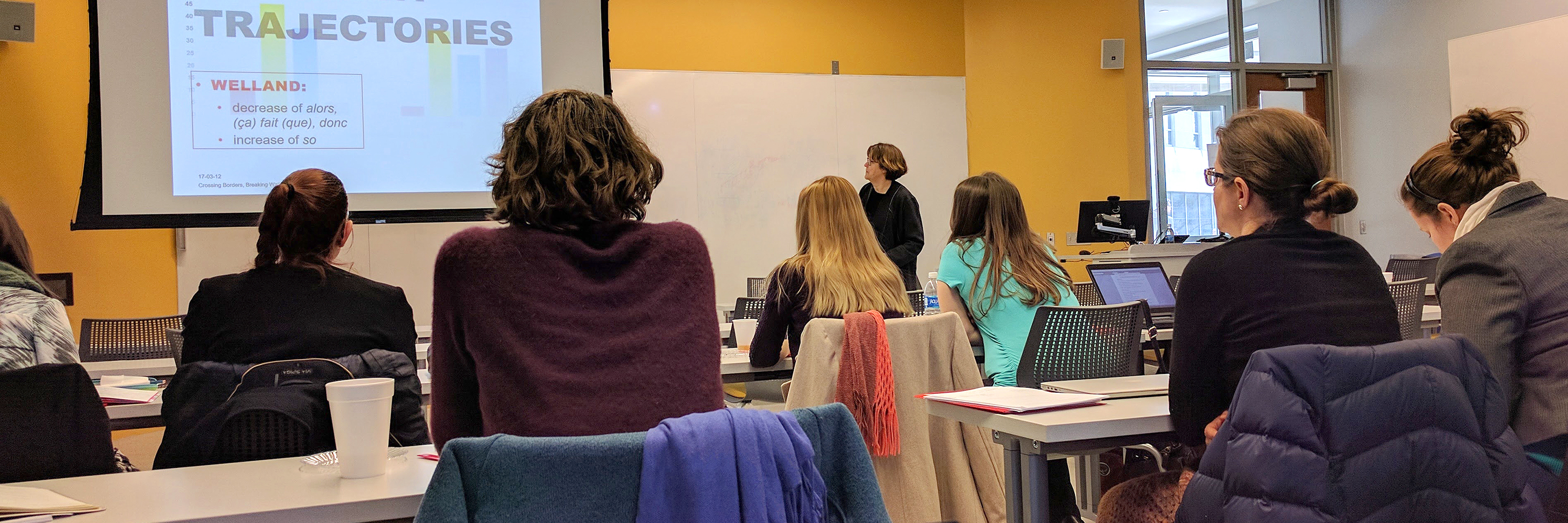 Students viewing a presentation in a Department of French and Italian graduate class. 