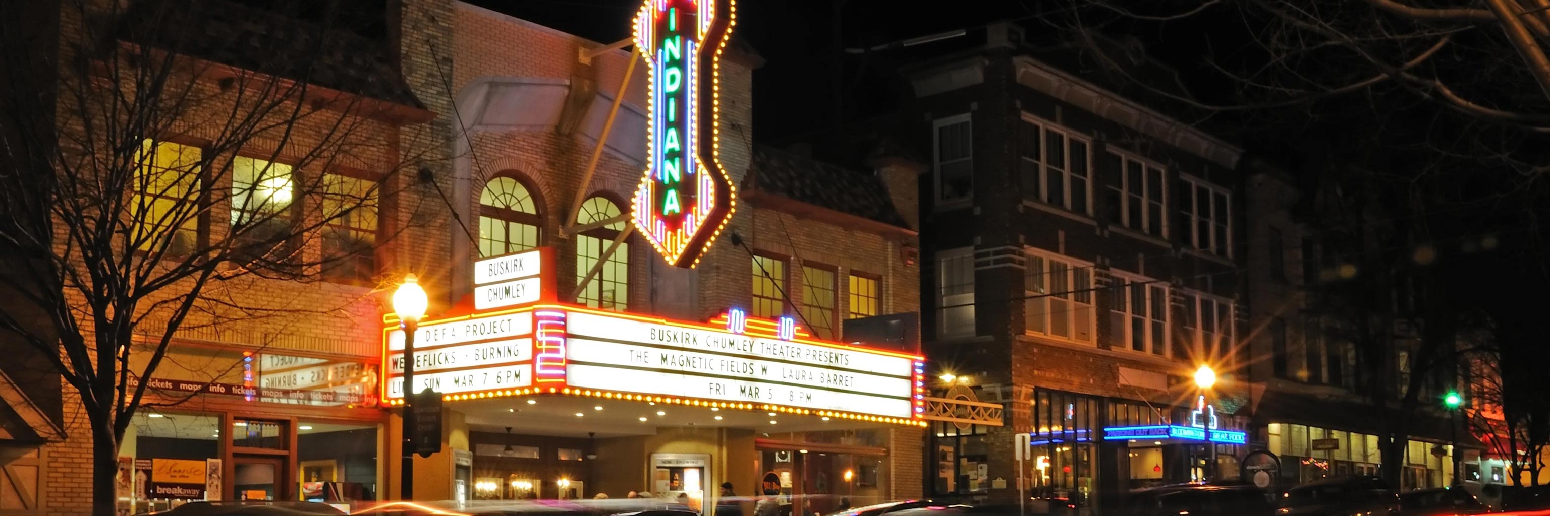 The Buskirk-Chumley Theater sign illuminated at night on Kirkwood Avenue in Bloomington, Indiana.