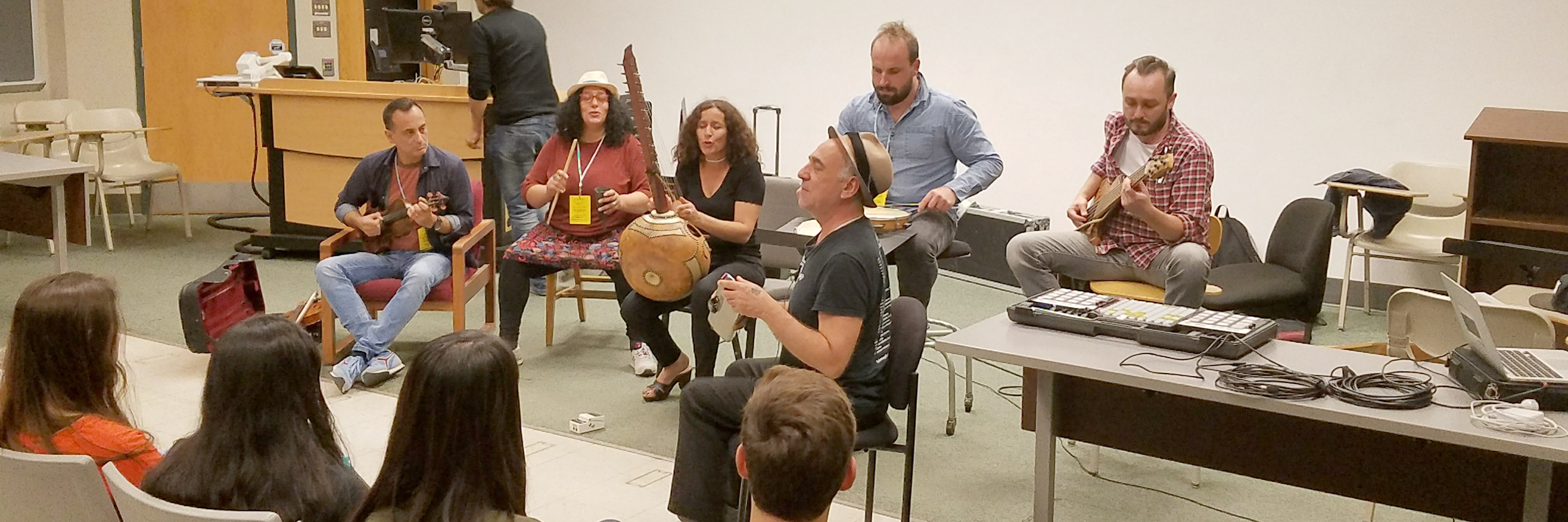 Musicians play music at a Department of French and Italian event. 
