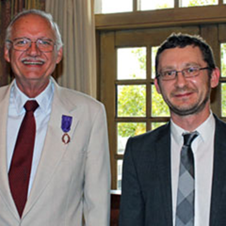Officier Emanuel Mickel with Attaché culturel adjoint Jean-François Rochard.