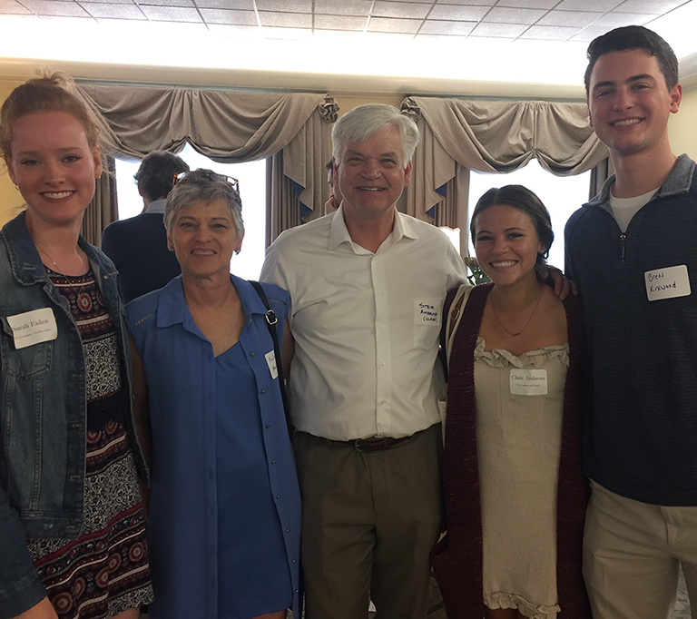 Sarah Eiden and Claire Ambrose with family members