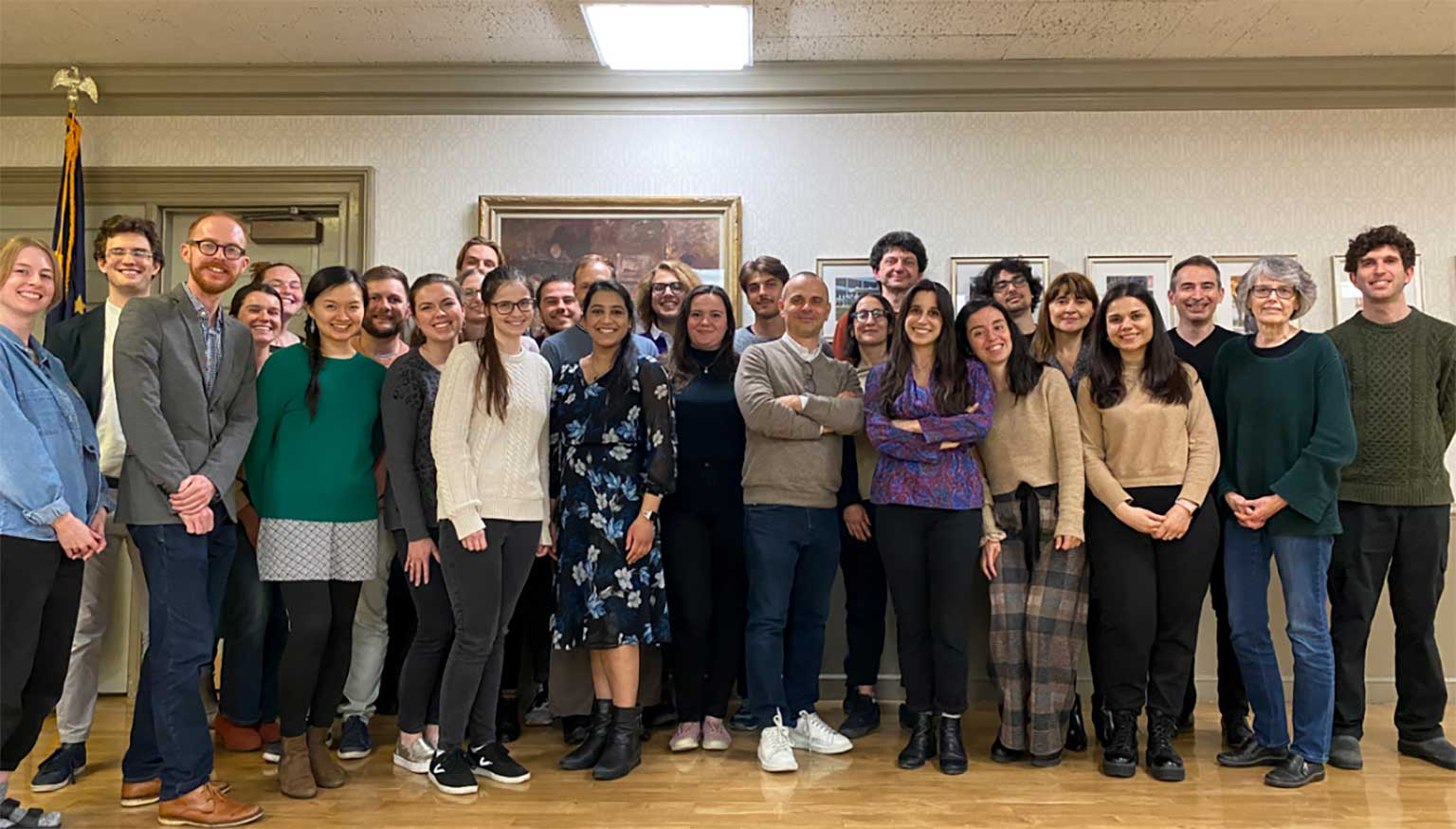 A large group of people pose in one of the rooms of the Indiana Memorial Union.
