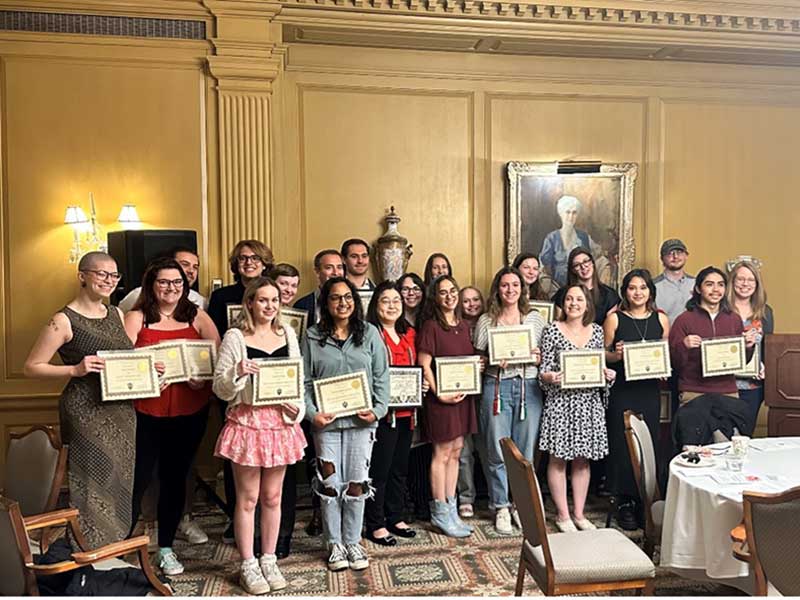 Students pose with their awards in the Indiana Memorial Union